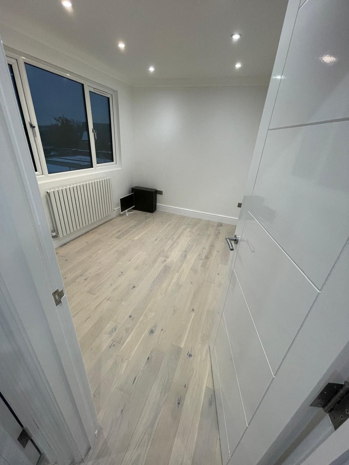 Finished bedroom with oak flooring